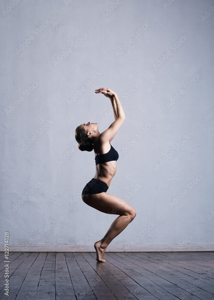 Young and fit ballerina dancer in a studio Young and fit ballerina dancer in a studio