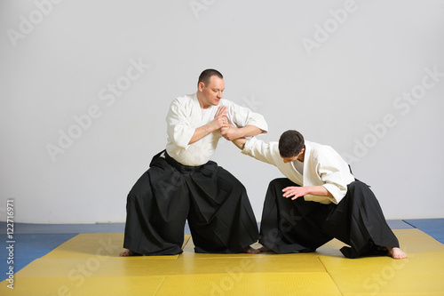The martial art of Aikido. two men demonstrate the techniques of