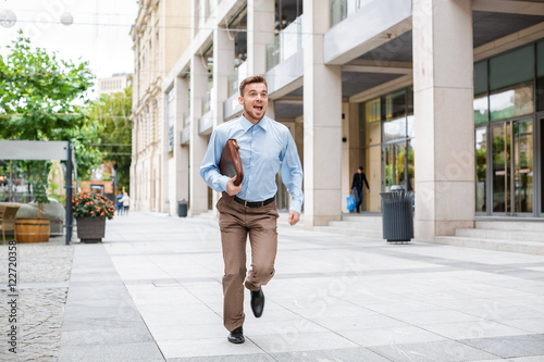 businessman with briefcase running