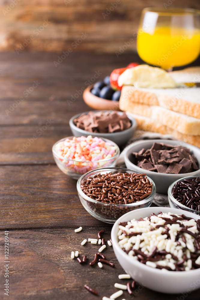 Assorted dutch hagelslag sprinkles. Netherlands traditional sweets for breakfast. Copy space. Assorted dutch hagelslag sprinkles. Netherlands traditional sweets for breakfast. Copy space.