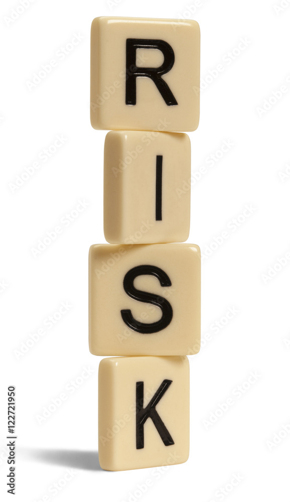 Risk spelled out with lettered tiles on white background. Clipping path included. Risk spelled out with lettered tiles on white background. Clipping path included.