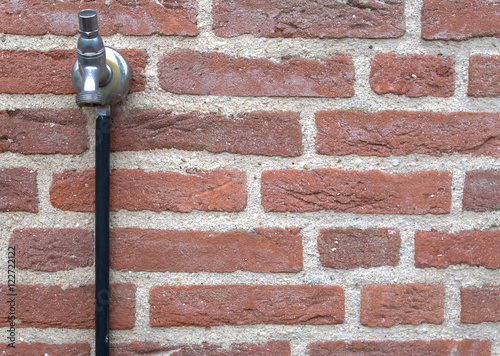 outside water tap. The handle has been removed in order to prevent random and vandal use by others.