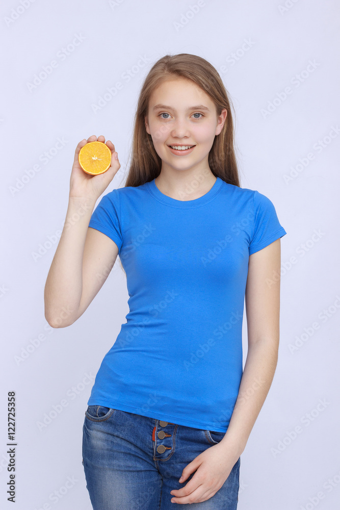 Joyful teen girl with orange Joyful teen girl with orange