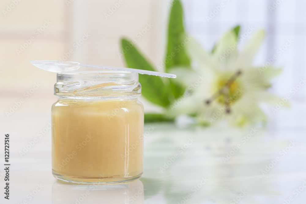raw organic royal jelly in a small bottle with passion flower raw organic royal jelly in a small bottle with passion flower