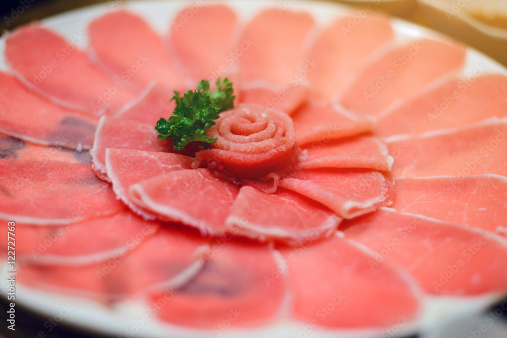 Fresh pork slice for shabu or sukiyaki on circle dish - Japanese food, raw food