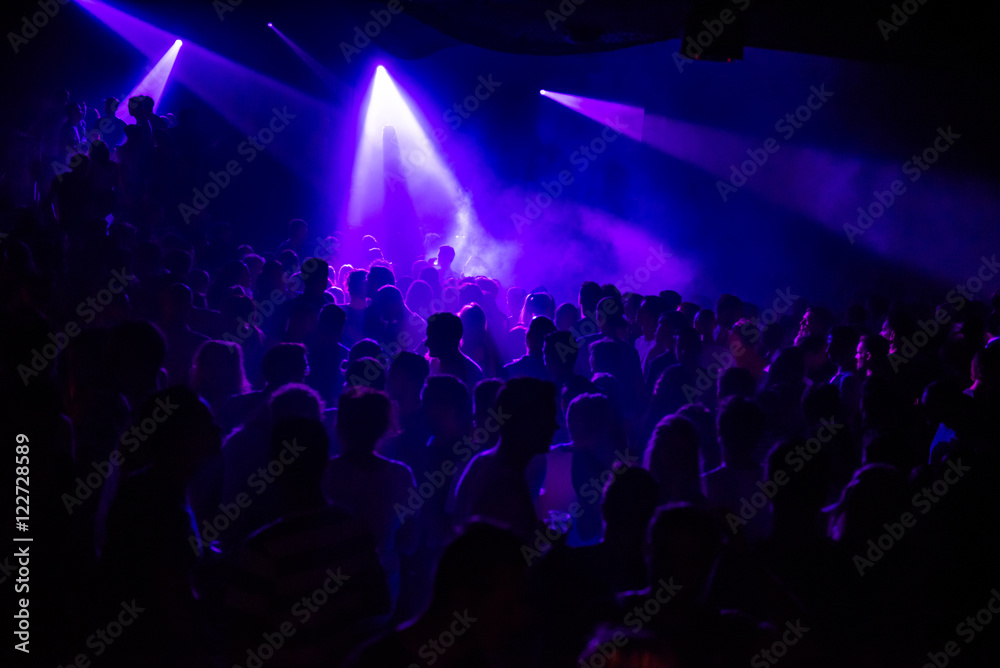 Purple lights in a crowded club