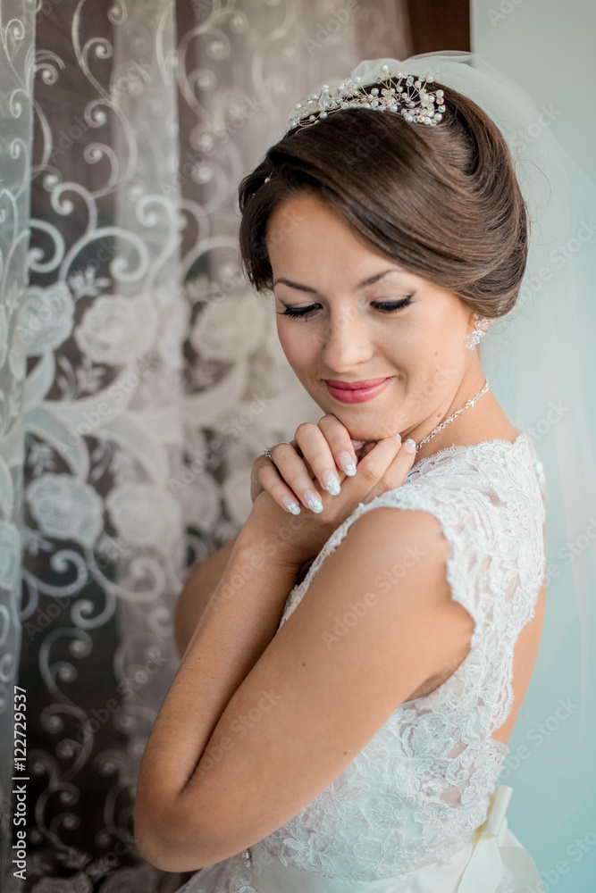 Bride looks out of the window,wedding day Bride looks out of the window,wedding day