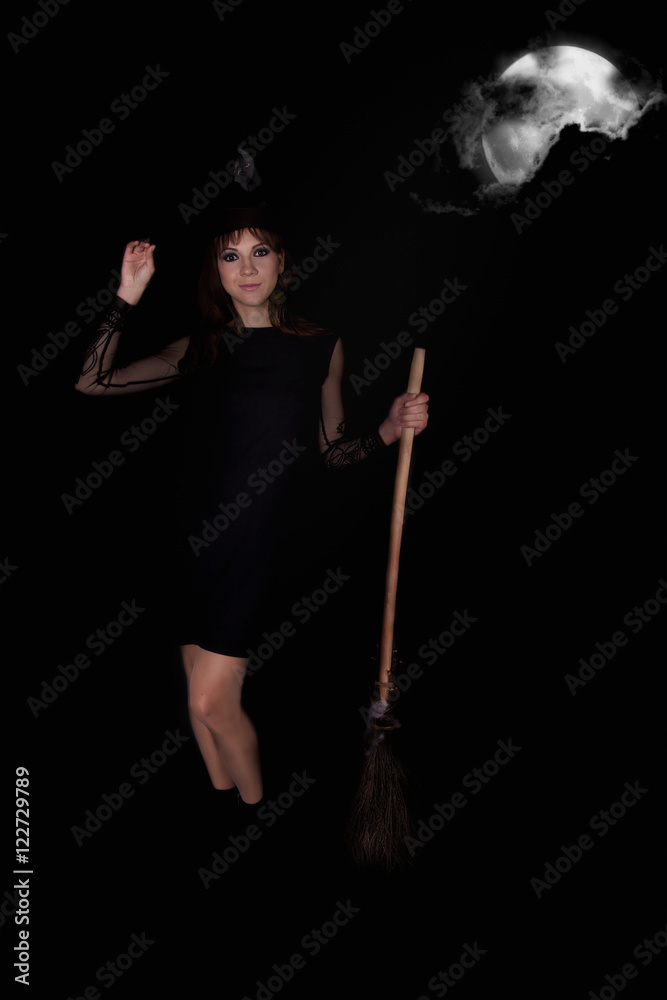 girl with a broom in a suit for a holiday Halloween, background