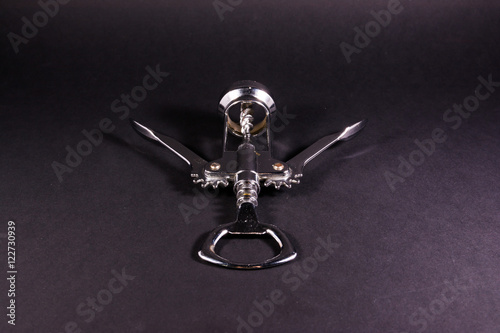 Принти на полотні Corkscrew Metal Bottle Opener Still Life Black Background Object
