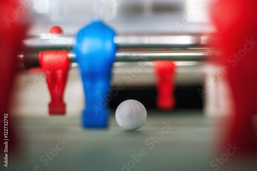 Red and blue foosball players in a row