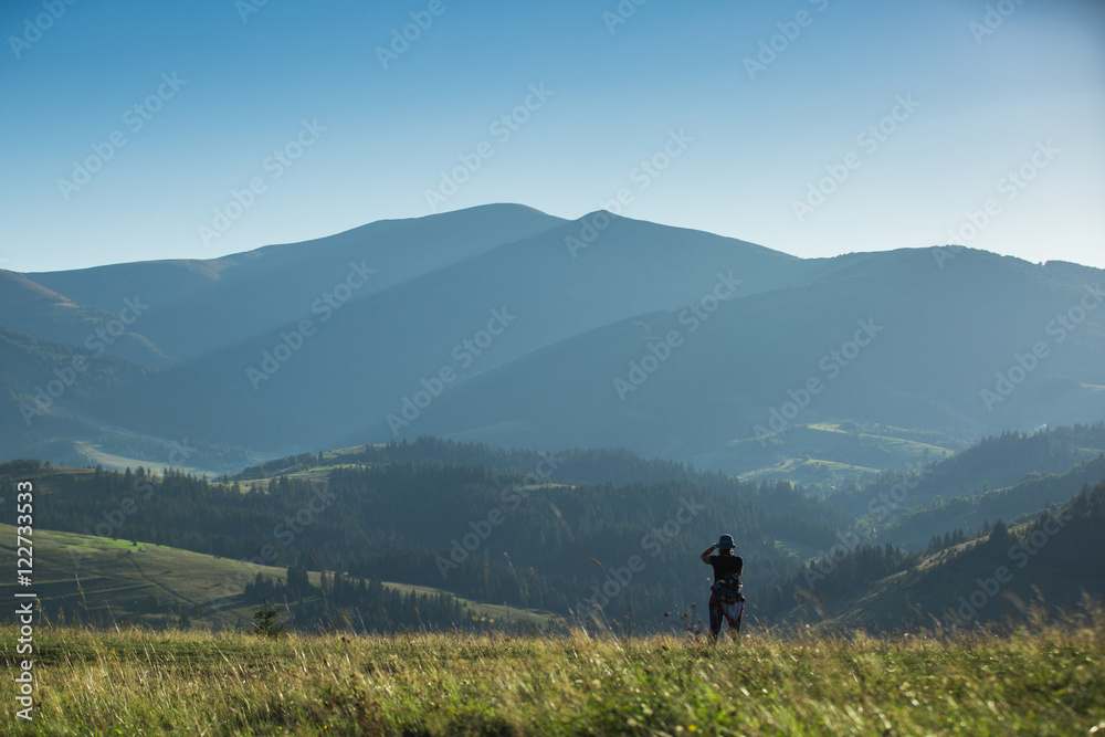 Photographer shoots a mountain landscape