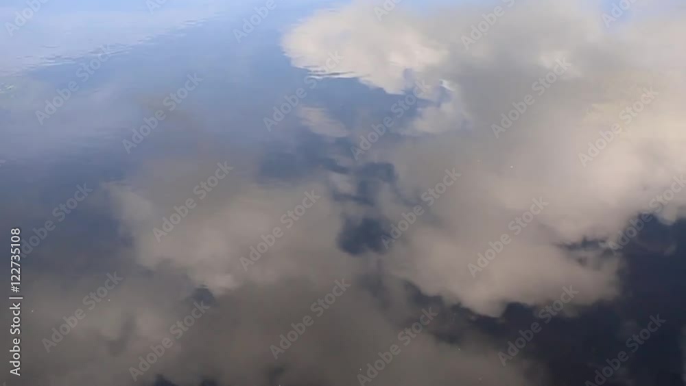 Artistic cloudy sky reflection in the water. Artistic cloudy sky reflection in the water.