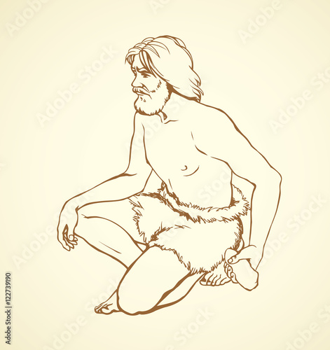 Vector picture. Primitive man draws on stone wall of cave