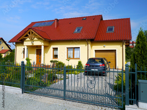 Yellow residential dwelling with red roof in Poland