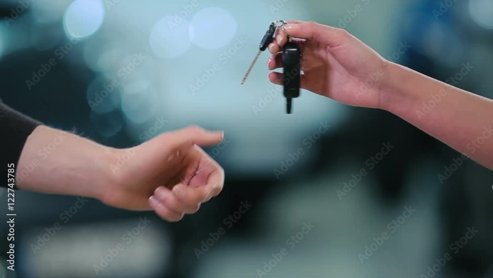 Man give a cars keys the girl