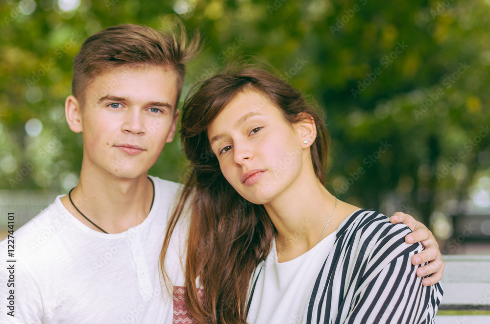 Romantic couple together in a park in autumn Romantic couple together in a park in autumn