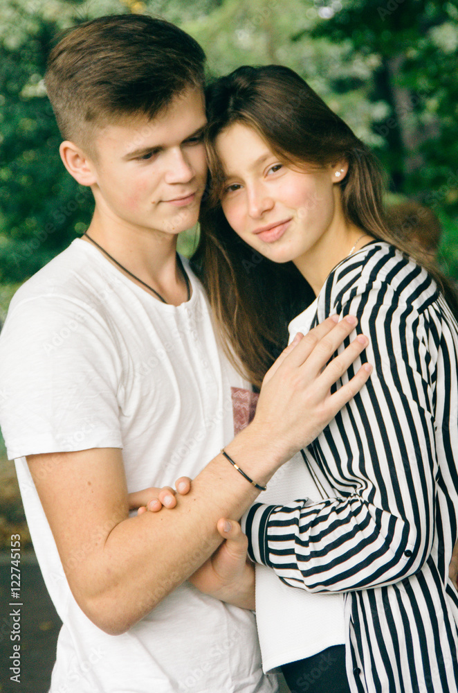 Romantic couple together in a park in autumn Romantic couple together in a park in autumn