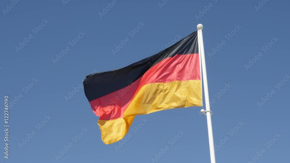 Flag of Germany waving in front of blue sky 4K 2160p 30fps UHD footage - Recognizable German national symbol on flag pole floating on wind 3840X2160 UltraHD video Flag of Germany waving in front of blue sky 4K 2160p 30fps UHD footage - Recognizable German national symbol on flag pole floating on wind 3840X2160 UltraHD video