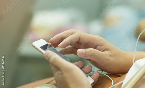 blurred of young man uses a smartphone