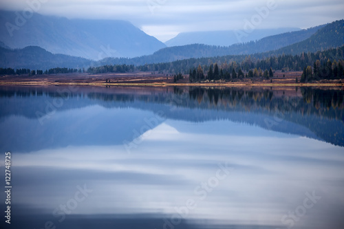 Overcast autumn morning on a mountain lake