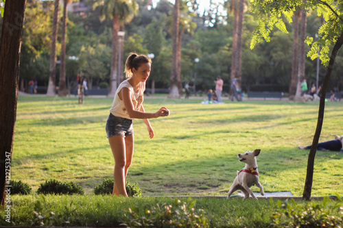 Girl playing with her dog