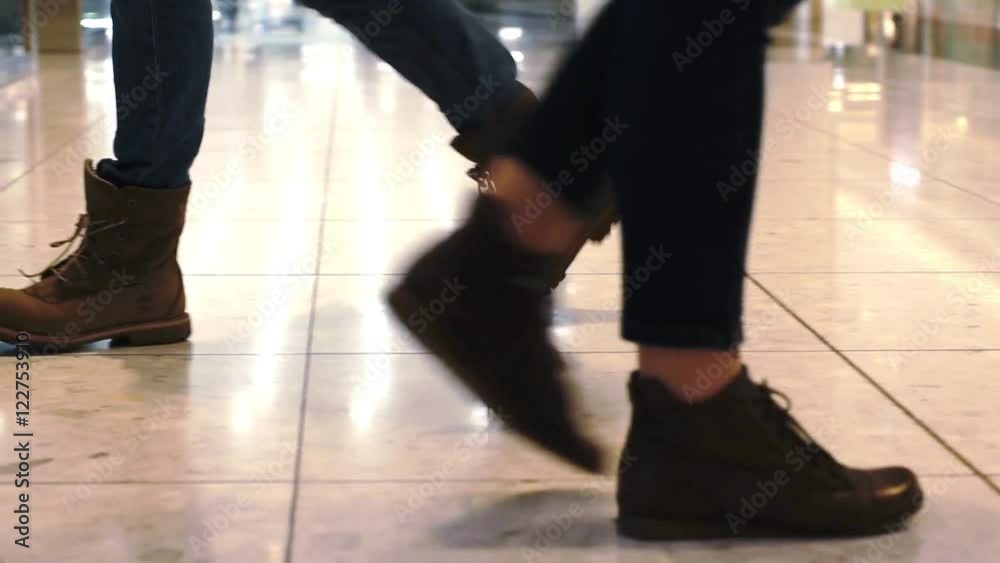 Woman in boots enters elevator Woman in boots enters elevator
