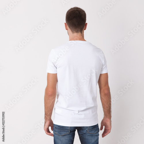 t-shirt design and people concept - close up of young man in blank white t-shirt. Clean shirt mock up for design