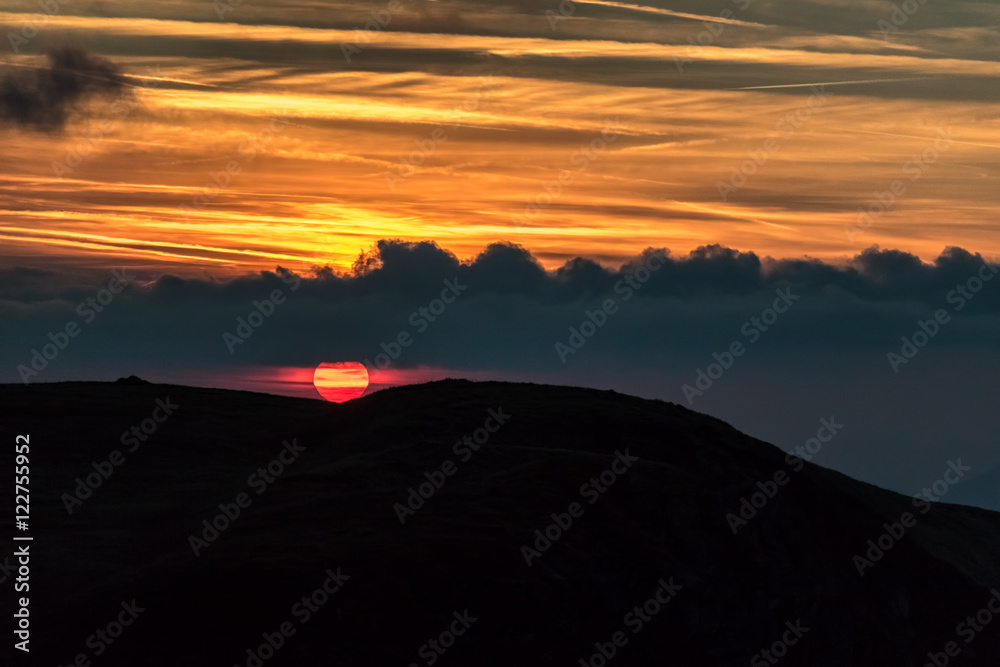 Amazing evening sky in golden sunset colors