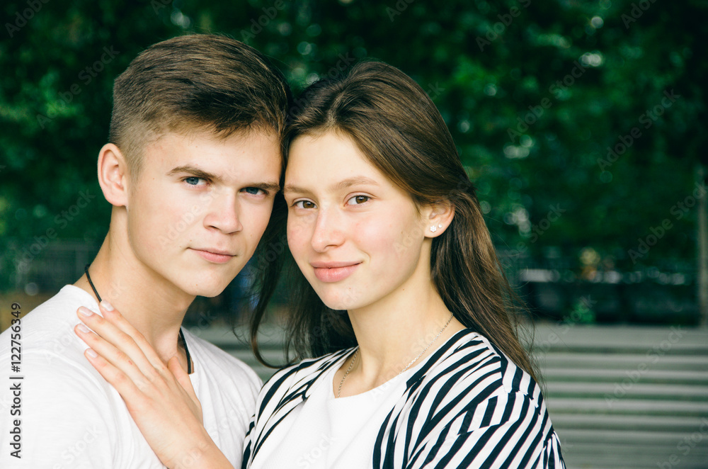 Romantic couple together in a park in autumn Romantic couple together in a park in autumn
