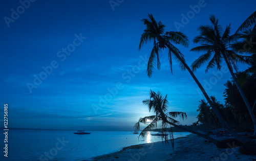 Tropical beach background of night view from Dumaluan Beach at P
