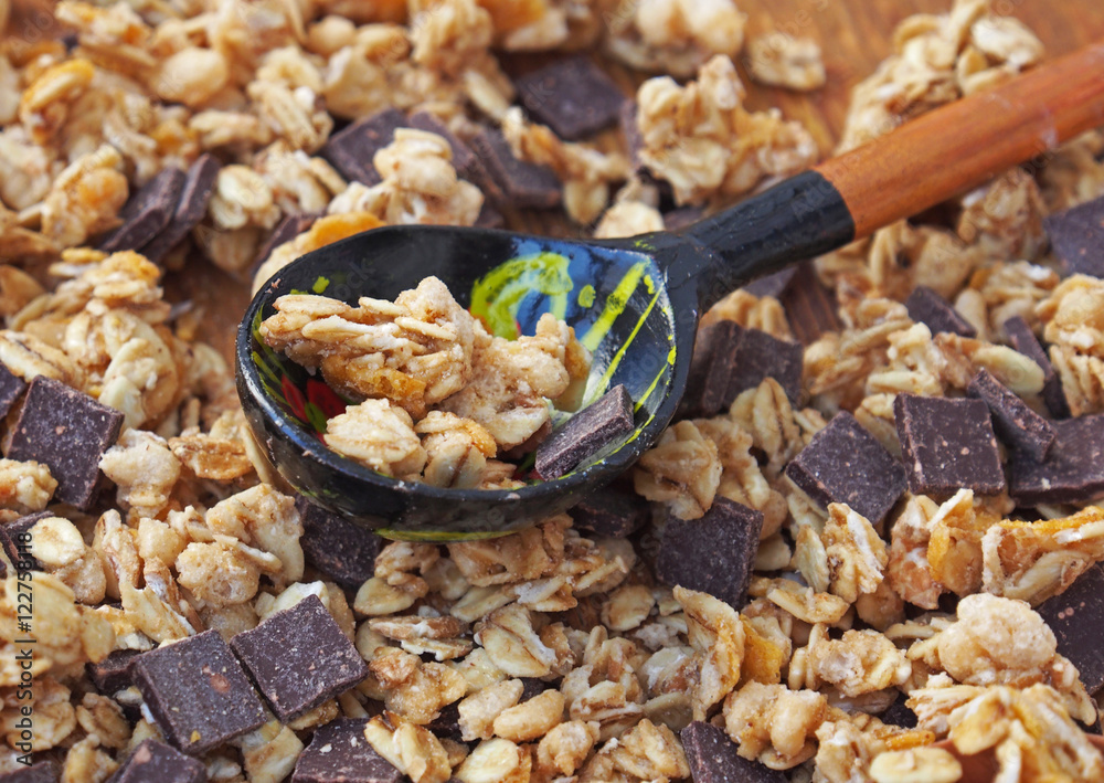 Healthy breakfast - chocolate muesli in wooden table Healthy breakfast - chocolate muesli in wooden table