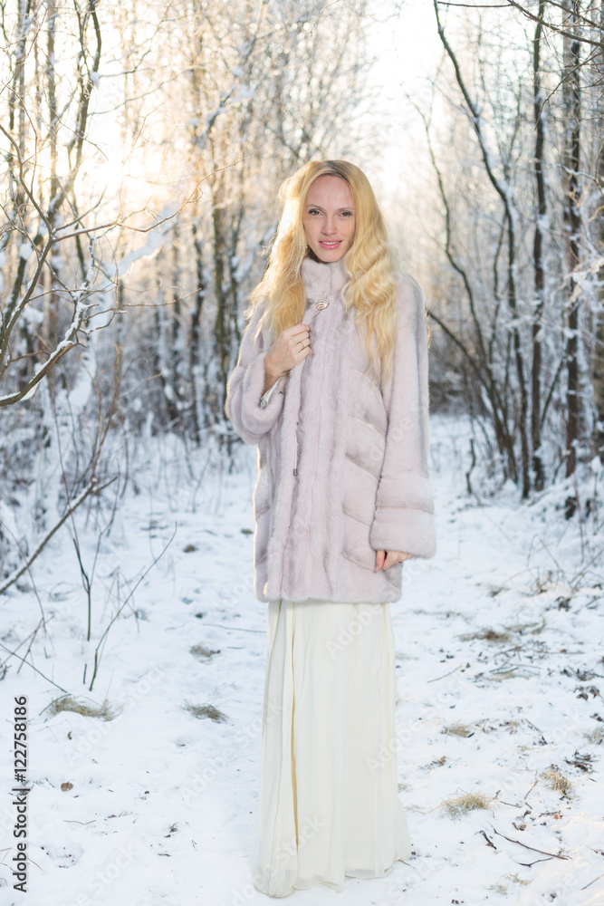 Model in winter forest