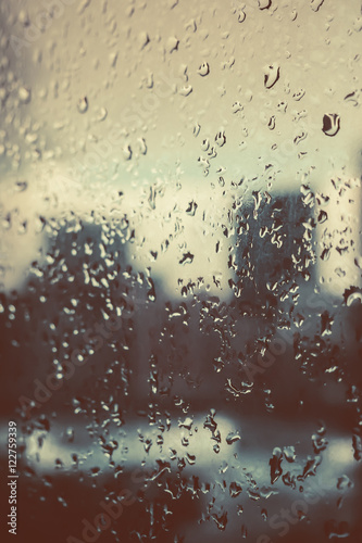 Raindrops on the glass window.vintage tone