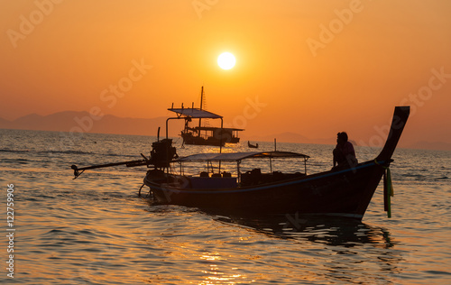 Sunset view wirh boats at pranang beach of Railay Krabi Thailand