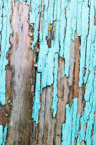 old, weathered boards with peeling paint.