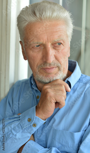 Wallpaper Mural Sad senior man at home Torontodigital.ca