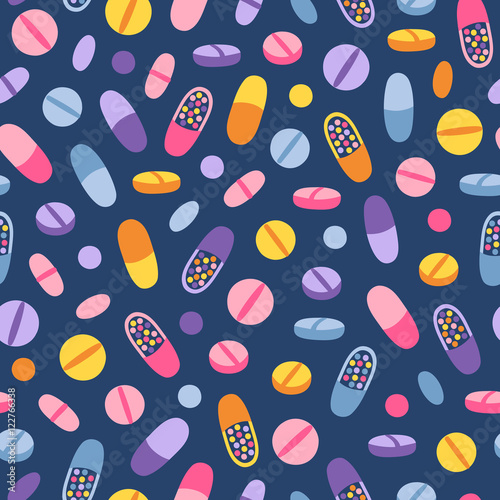 Colorful medical pills seamless pattern on blue background