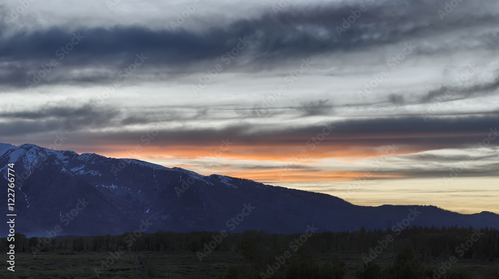 Sun setting behind the Tetons, Grand Teton National Park