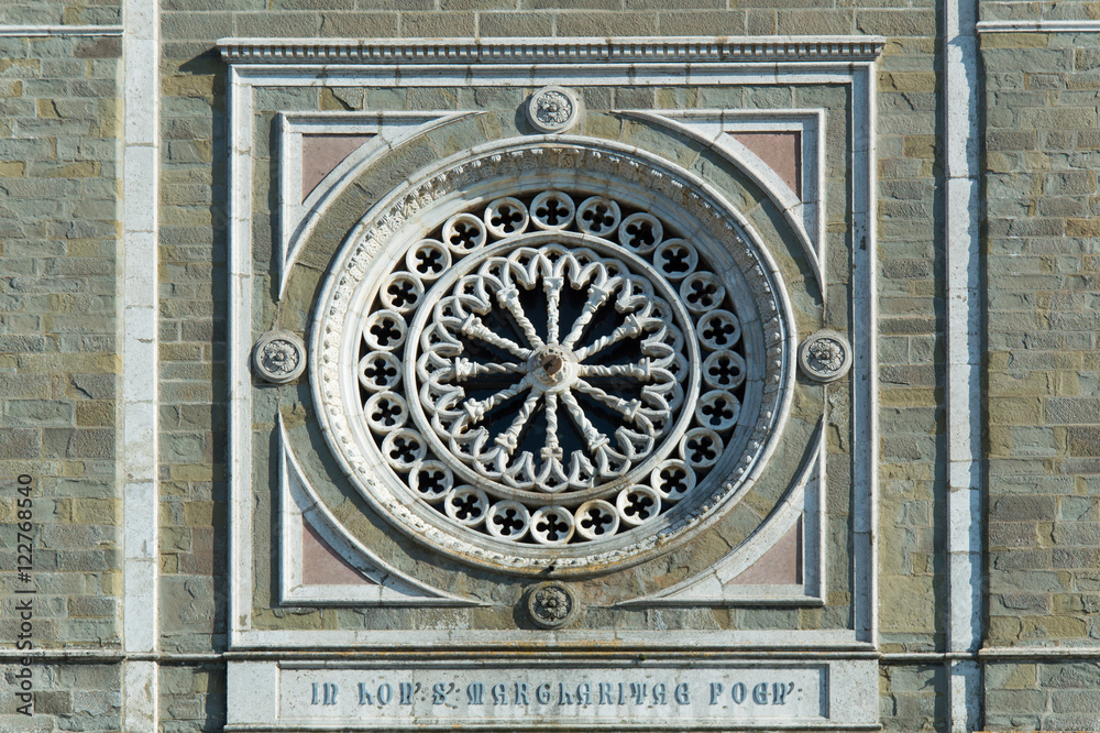 Rose window of Santa Maria church in Cortona Tuscany Italy
