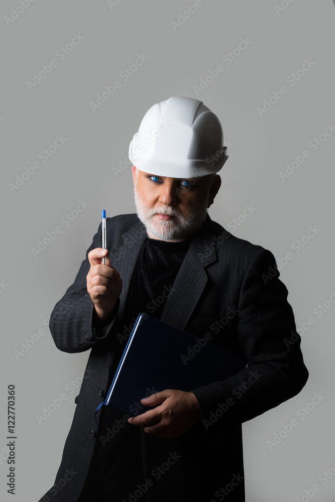 Man in hard hat with notebook Man in hard hat with notebook