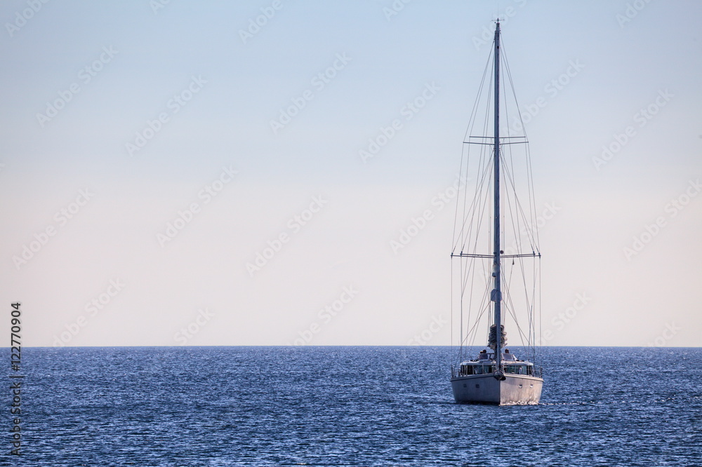 A single sailboat on the ocean