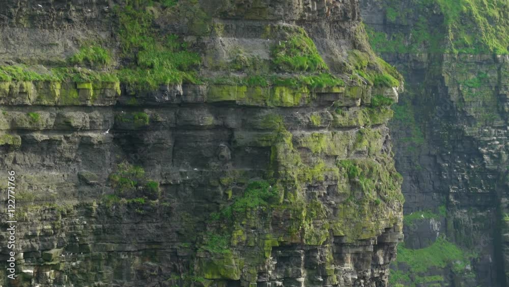 The big rocks on the Moher Cliffs in Ireland. The Cliffs of Moher are located at the southwestern edge of the Burren region in County Clare Ireland. The big rocks on the Moher Cliffs in Ireland. The Cliffs of Moher are located at the southwestern edge of the Burren region in County Clare Ireland.
