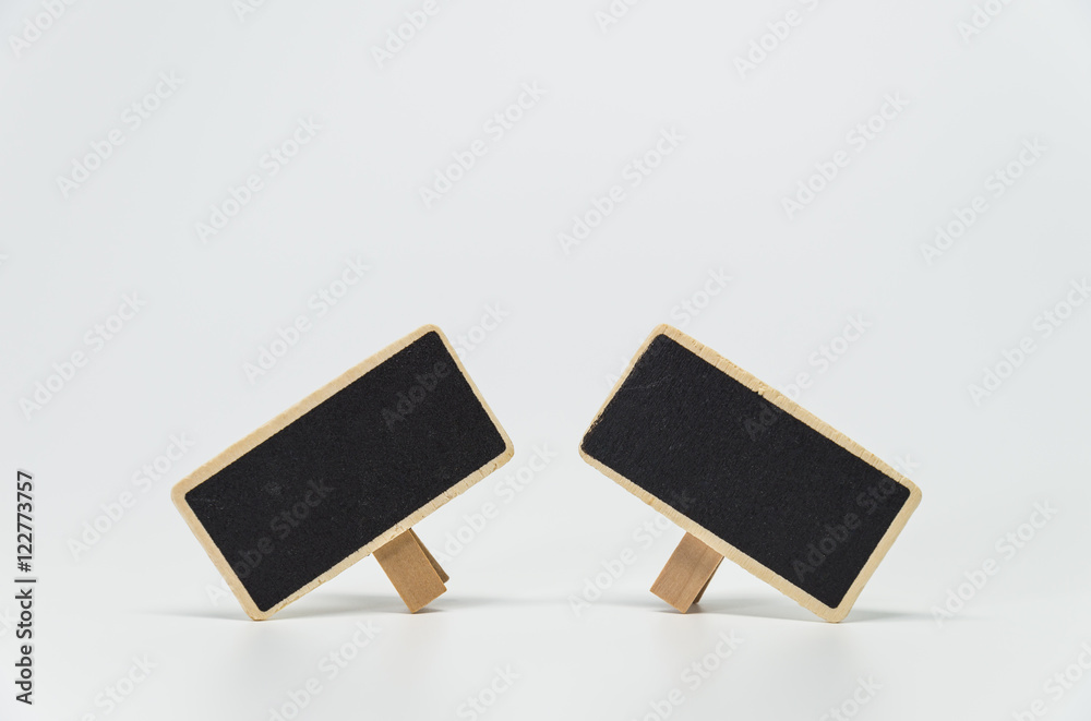 Two small black board with white background and selective focus Two small black board with white background and selective focus