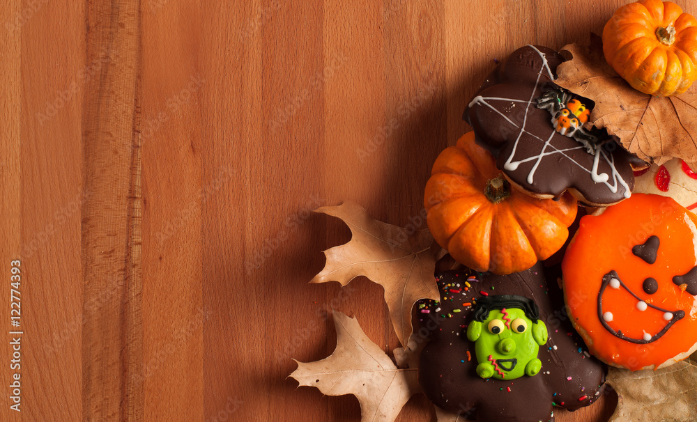 Funny halloween gingerbread cookies on wooden table Funny halloween gingerbread cookies on wooden table