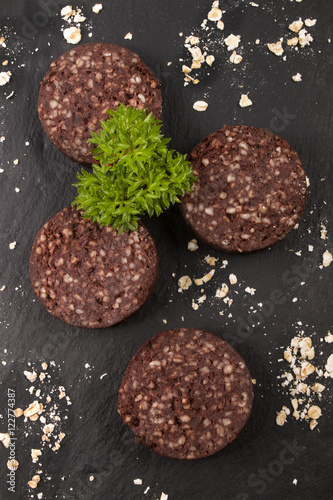 raw black pudding with oatmeal and parsley