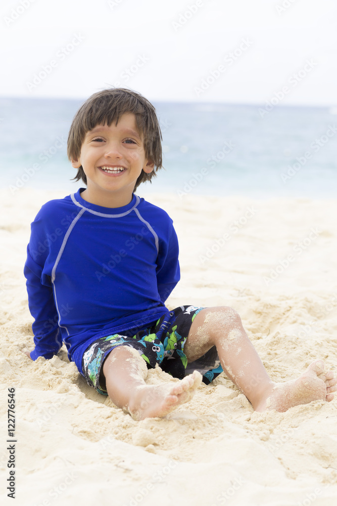 Happy Boy Playing at the beach