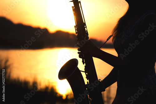 Canvas Print silhouette of a saxophone in the sunlight