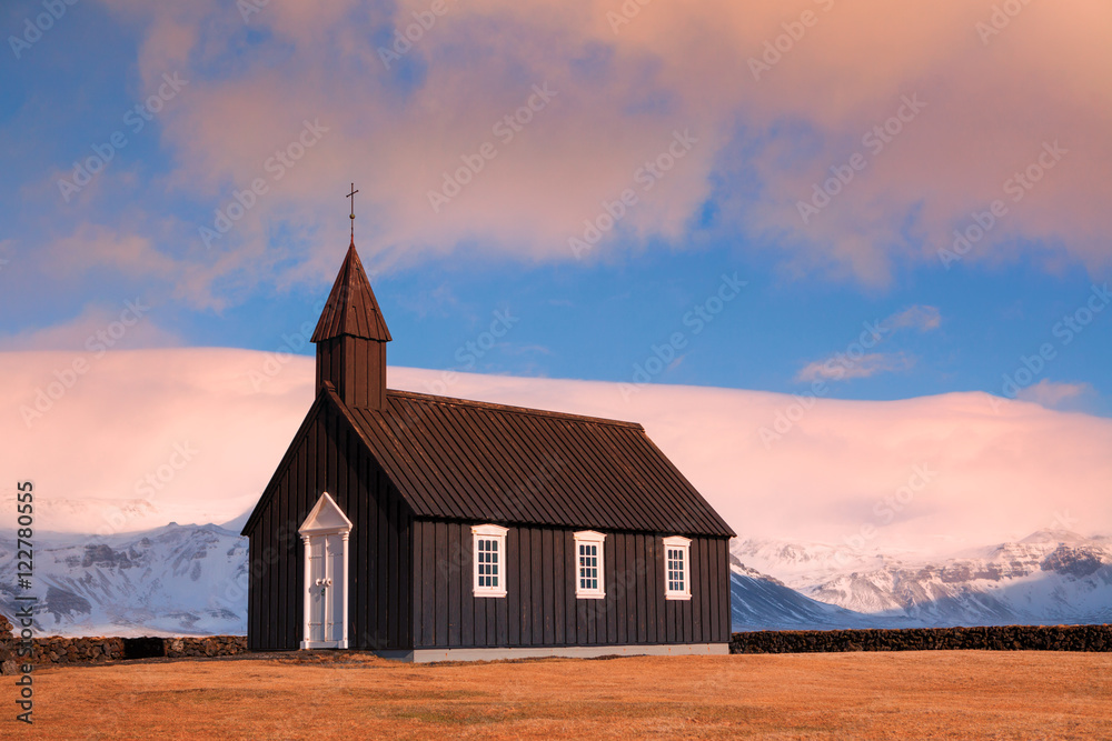 Black Church of Budir in Iceland sunset