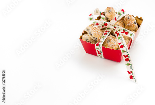 Mini Christstollen in a festive red tray decorated with ribbon isolated on white background. Lots of copy space.  photo