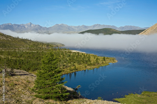 A cloud of mist over a mountain lake. Lake Darpir. Yakutia. Russia.